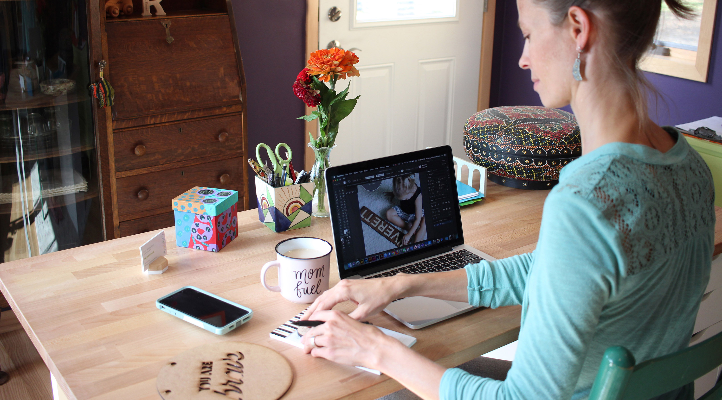 Kathleen at Desk in Home Office Co-Founder Smiling Tree Toys and Smiling Tree Gifts - Kathleen Batalden Smith