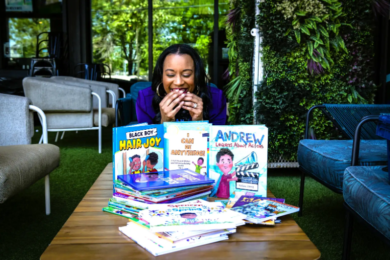 Tiffany Obeng with her books